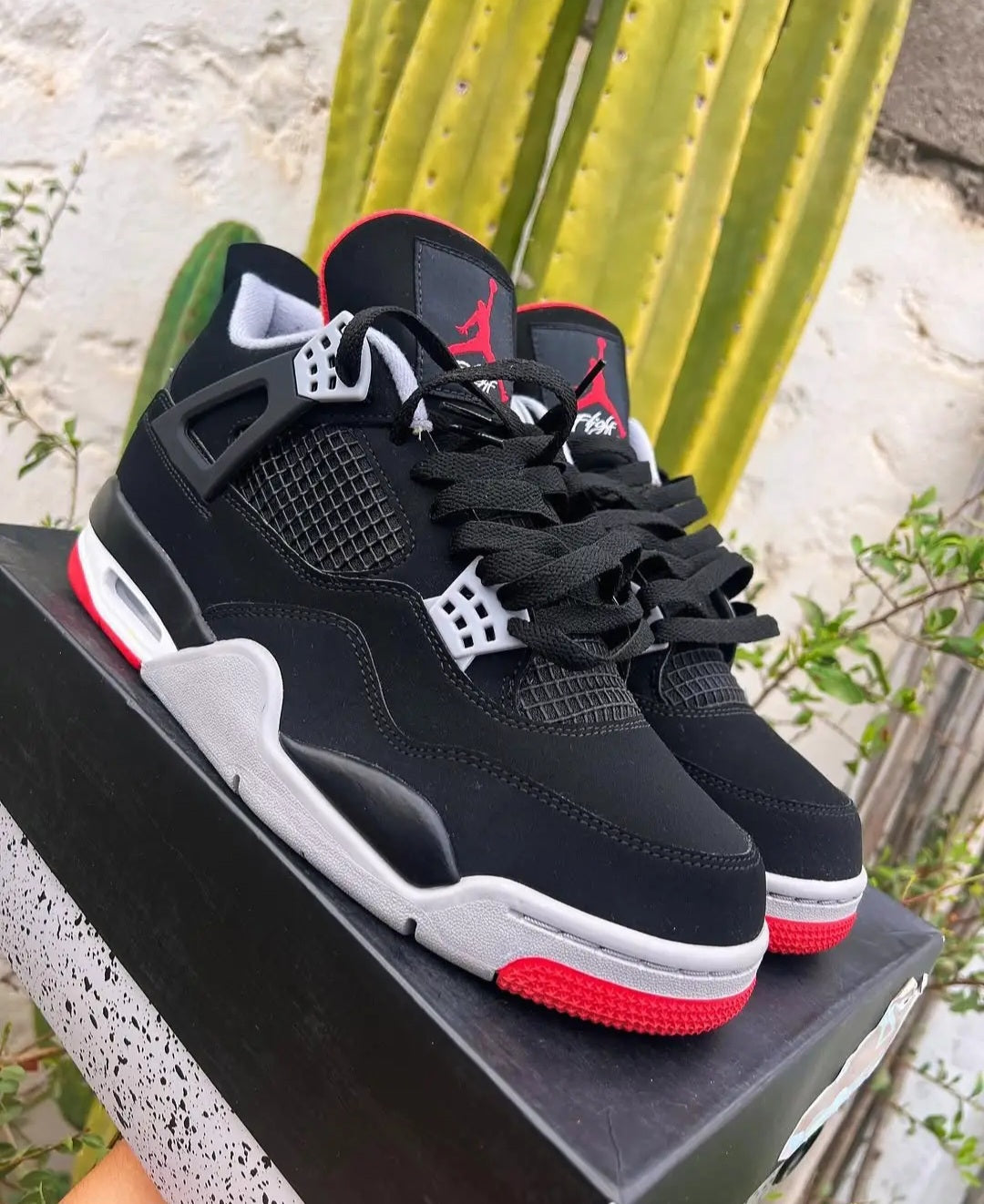 Air Jordan 4 — Black/Cement "Bred"