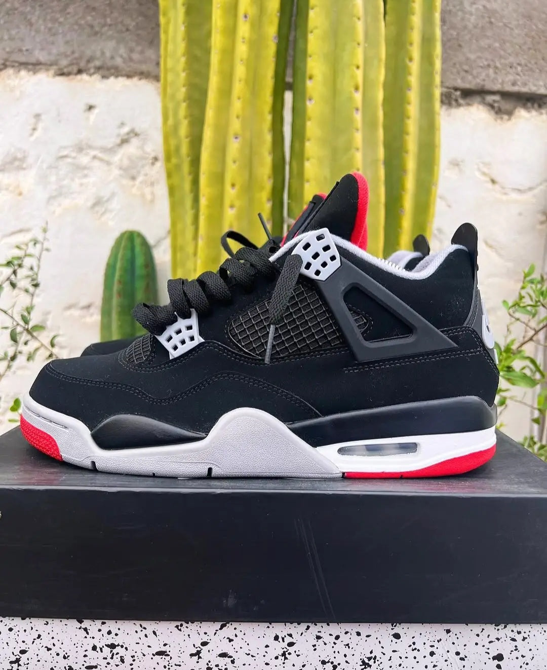Air Jordan 4 — Black/Cement "Bred"